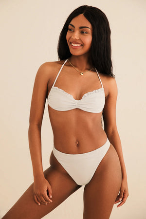 Timani is 5'8.5" wearing Size S.
