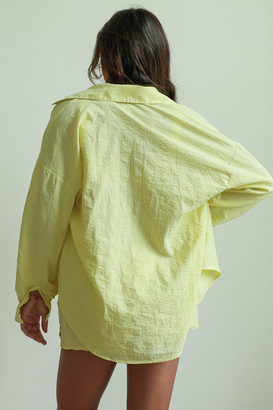 Shana is 5'5" wearing XS.