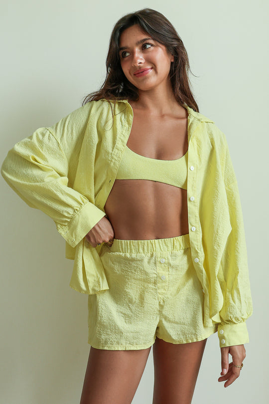 Shana is 5'5" wearing XS.