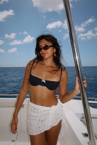 Shana is 5'5" wearing XS.